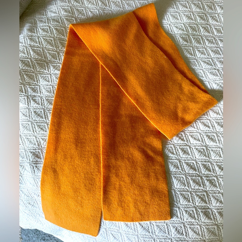Orange cashmere scarf. 5” wide. 64” long.